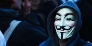 Person wearing a Guy Fawkes Mask